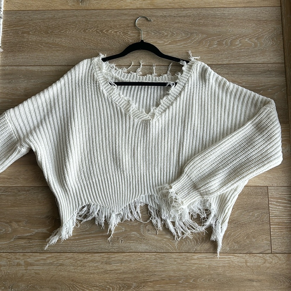 White ripped sweater